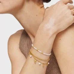 Chain Bracelet with 18kt gold plating over silver and cultured pearls and motifs TOUS Grain