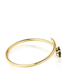 Open bracelet with 18kt gold plating over silver and onyx Cachito Mío