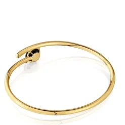 Open bracelet with 18kt gold plating over silver and onyx Cachito Mío