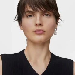 Single silver earring with motif Medallions